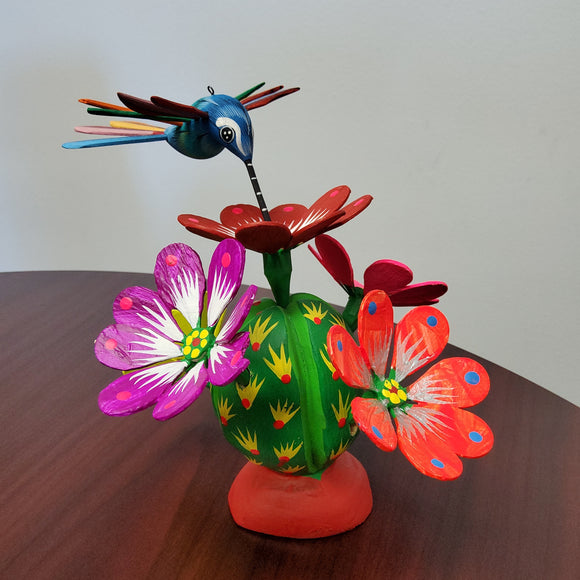Hummingbird with cactus flowers