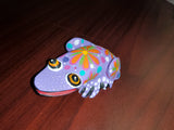 Colorful wood carving frogs